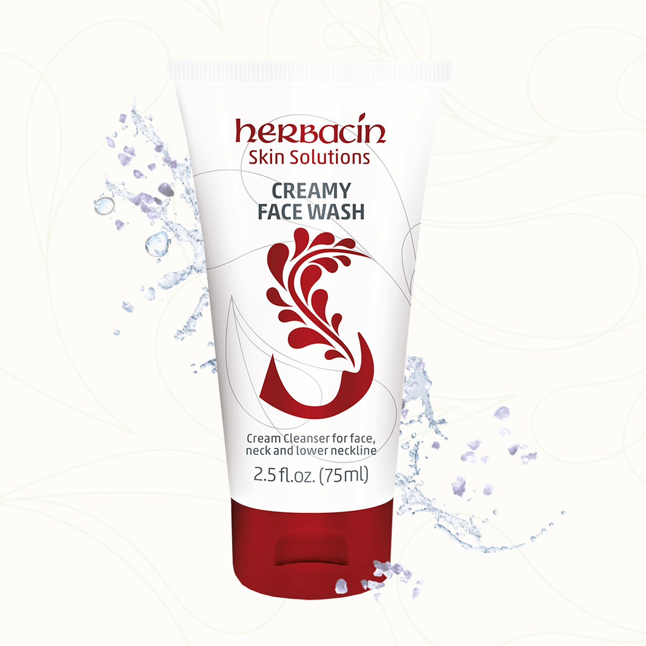 Herbacin Skin Solutions Creamy Face Wash in weißer Tube mit rotem Verschluss, umgeben von Wasserspritzern – für die sanfte Gesichtsreinigung