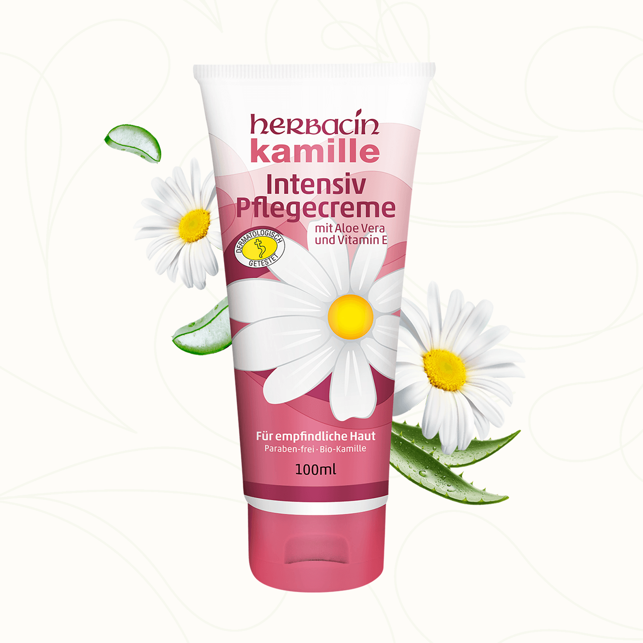 Herbacin Kamille Intensiv Pflegecreme mit Aloe Vera und Vitamin E in rosa Tube, dekoriert mit Kamillenblüten und Aloe-Blättern – ideal für empfindliche Haut